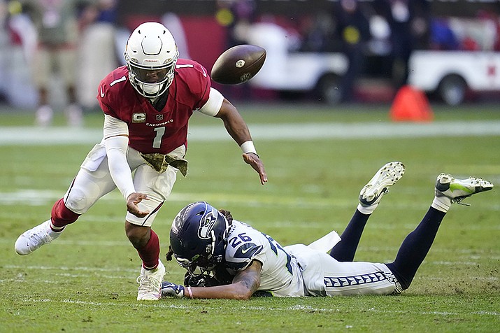 Arizona Cardinals quarterback Kyler Murray (1) fumbles the ball after being hit by Seattle Seahawks safety Ryan Neal (26) during the first half of an NFL football game in Glendale, Ariz., Sunday, Nov. 6, 2022. The Seahawks recovered the ball. (Ross D. Franklin/AP)