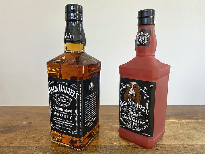 A bottle of Jack Daniel's Tennessee Whiskey is displayed next to a Bad Spaniels dog toy in Arlington, Va., Sunday, Nov. 20, 2022. Jack Daniel's has asked the Supreme Court justices to hear its case against the manufacturer of the toy. (Jessica Gresko/AP)