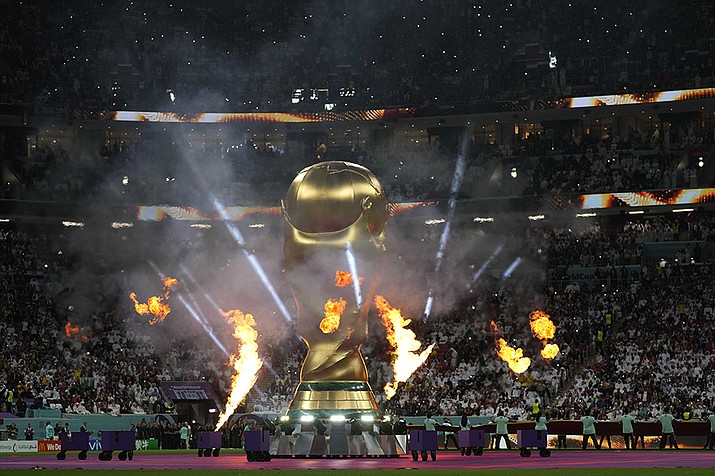 A giant inflatable copy of the trophy is displayed prior to the start of the World Cup group A soccer match between Qatar and Ecuador at the Al Bayt Stadium in Al Khor, Qatar, Sunday, Nov. 20, 2022. (Darko Bandic/AP)