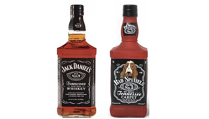 The company that makes Jack Daniel's is howling mad over a squeaking dog toy that parodies the whiskey's signature bottles, shown here with the Bad Spaniels Silly Squeaker, and is seeking Supreme Court intervention. (Photo from court filing by Jack Daniels)