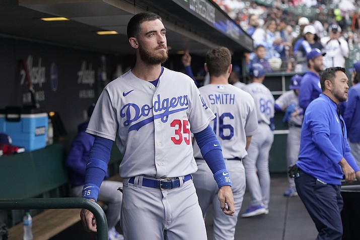 Los Angeles Dodgers' Cody Bellinger stands in the dugout before the team's game against the San Francisco Giants in San Francisco, Aug. 2, 2022. The Dodgers didn't tender Bellinger a contract on Friday, Nov. 18, making the 2019 National League MVP a free agent. (Jeff Chiu/AP, File)