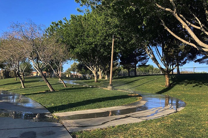 Sprinklers water grass at a park in the Summerlin neighborhood of Las Vegas. In November 2022, some of the largest water agencies in the western United States agreed to a framework that would dramatically reduce the amount of decorative grass in cities such as Los Angeles, Las Vegas, Salt Lake City and Denver. The agreement comes as the seven states that rely on the overtapped Colorado River are facing a dire future with less water to go around. (AP Photo/Ken Ritter, File)