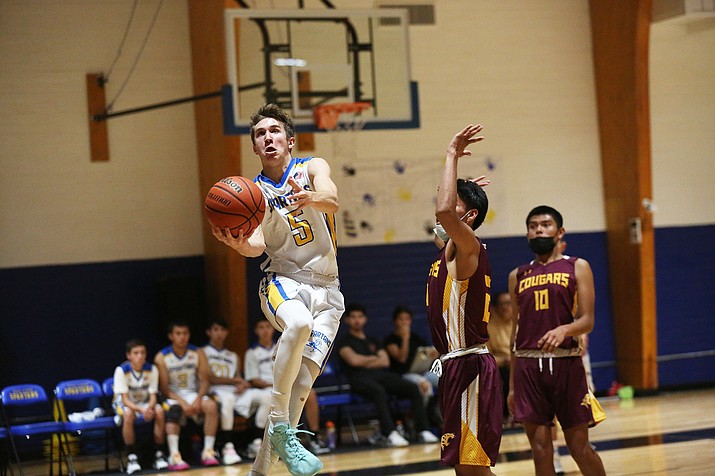 Spartan Gabril Zeller drives the ball to the hop in a game with Rock Point. (Marilyn R. Sheldon/WGCN)