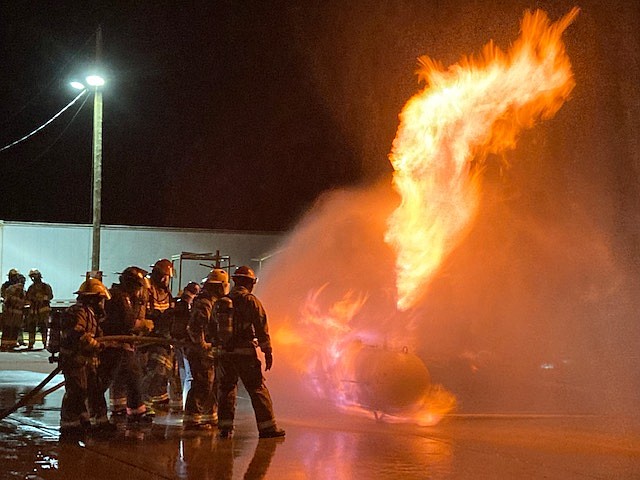 Firefighter students are seen practicing nighttime firefighting at the Verde Fire Training Center. (Yavapai College Fire Academy/Courtesy)