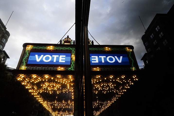 A marquee in downtown Atlanta displays the word "vote" on Election Day, Nov. 8, 2022, in Atlanta. Voters deciding to split their tickets or buck their party altogether may have helped Democrats mount a stronger-than-expected performance in the recent midterm elections. AP VoteCast is an extensive survey of this year’s electorate. The survey underscores how voters were selective in their choices despite today’s starkly polarized political climate. Party preferences aside, they often rewarded candidates seen as mainstream while rejecting those viewed as too extreme. (Brynn Anderson/AP, File)