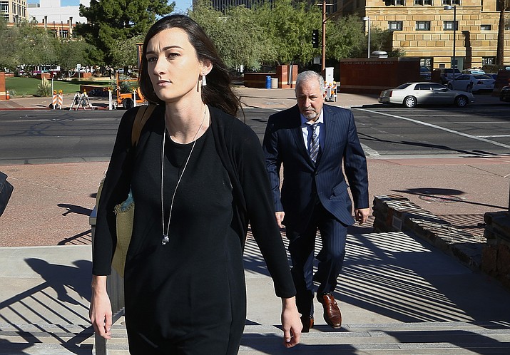 Laney Sweet, left, widow of Daniel Shaver, arrives Oct. 25, 2017, at Maricopa County, Ariz., Superior Court in Phoenix with attorney Mark Geragos, right, for opening statements in the trial of former Mesa, Ariz., Police Officer Philip Brailsford, charged with murder in the fatal 2016 shooting of the unarmed Shaver. On Tuesday, Nov. 22, 2022, Sweet agreed to settle her wrongful death lawsuit. A notice of settlement filed in federal court in Arizona shows that Sweet and her two children will receive $8 million from the city of Mesa. (Ross D. Franklin/AP, File)