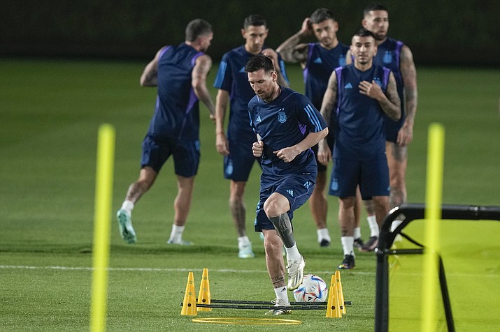 Lionel Messi warms up during Argentina official training on the eve of the group C World Cup soccer match between Argentina and Mexico, in Doha, Qatar, Friday, Nov. 25, 2022. (Jorge Saenz/AP)