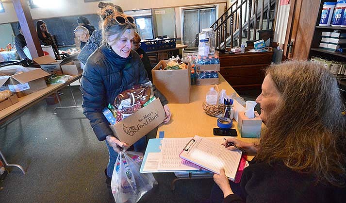 The Haven United Methodist Church has distributed food for almost 20 years, and residents again picked up food on Wednesday, Nov. 23, 2022. (VVN/Vyto Starinskas)