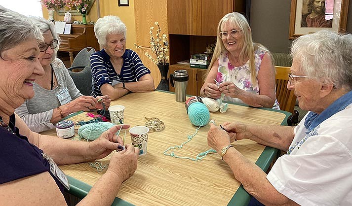Members of Widow’s Link knitting together after lunch (Photo courtesy Lois Henderson)