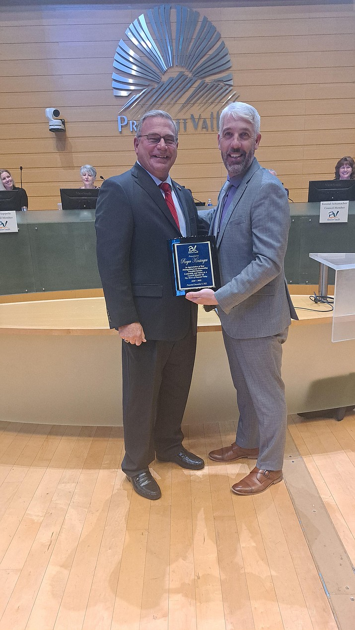 As an appreciation for a job well done, Mayor Kell Palguta, right, gave former Council member Roger Kinsinger a plaque, at his final town council meeting Monday, Nov. 28, 2022. (Debra Winters/Courier)