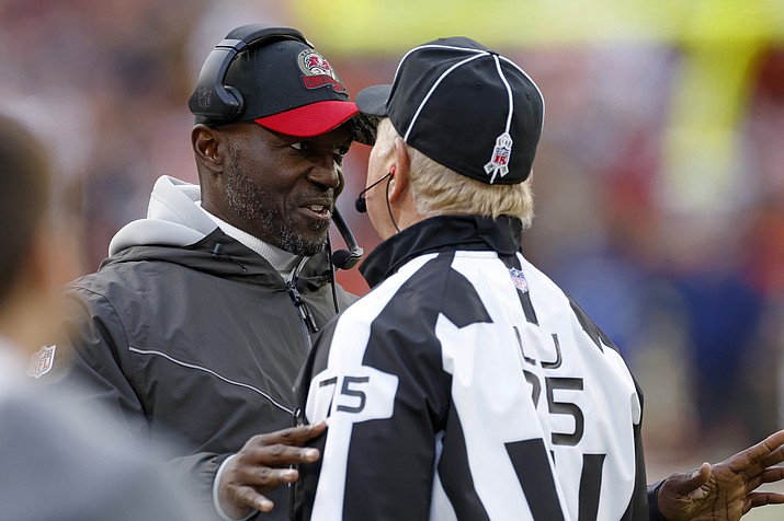 Tampa Bay Buccaneers coach Todd Bowles, left, talks with line judge Mark Stewart during the second half of the team’s NFL football game against the Cleveland Browns in Cleveland, Sunday, Nov. 27, 2022. (Ron Schwane/AP)