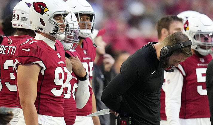 Arizona Cardinals head coach Kliff Kingsbury looks down during the second half of an NFL football game against the Los Angeles Chargers, Sunday, Nov. 27, 2022, in Glendale, Ariz. The Chargers defeated the Cardinals 25-24. (AP Photo/Ross D. Franklin)