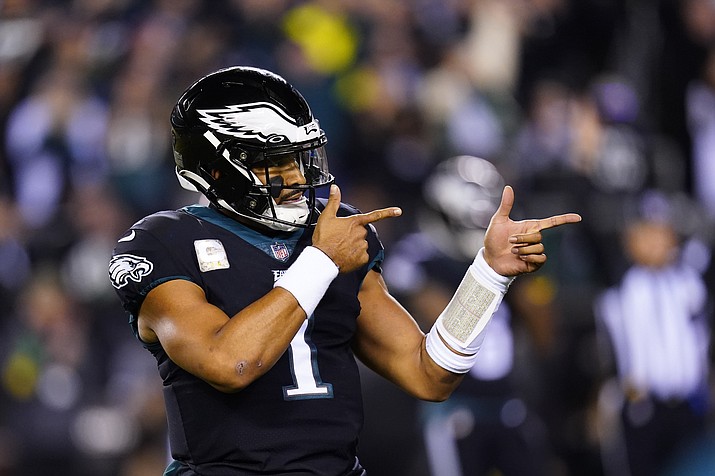 Philadelphia Eagles quarterback Jalen Hurts celebrates a touchdown run by Kenneth Gainwell during the first half of an NFL football game against the Green Bay Packers, Sunday, Nov. 27, 2022, in Philadelphia. (Chris Szagola/AP)