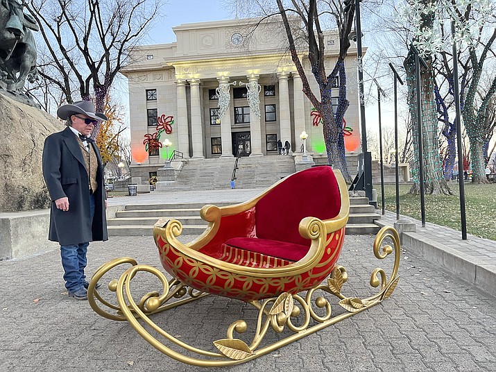 RIGHT: Prescott resident Mark Meredith, who has color blindness, checks out the new sleigh feature on the Yavapai County Courthouse Plaza Tuesday, Nov. 29, 2022, after the Arizona’s Christmas City lights were turned on for a trial run in advance of the Saturday, Dec. 3 Courthouse Lighting. (Cindy Barks/Courier)