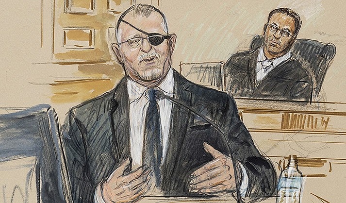 This artist sketch depicts the trial of Oath Keepers leader Stewart Rhodes, left, as he testifies before U.S. District Judge Amit Mehta on charges of seditious conspiracy in the Jan. 6, 2021, attack on the U.S. Capitol, in Washington, Nov. 7, 2022. Rhodes was convicted of seditious conspiracy on Nov. 29. (Dana Verkouteren via AP, File)