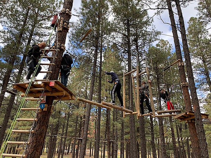 Williams High School students and teachers spend a day at the Flagstaff Extreme Adventure Course in Flagstaff for team building as part of the new senior-freshman mentorship program.  (Submitted photo)