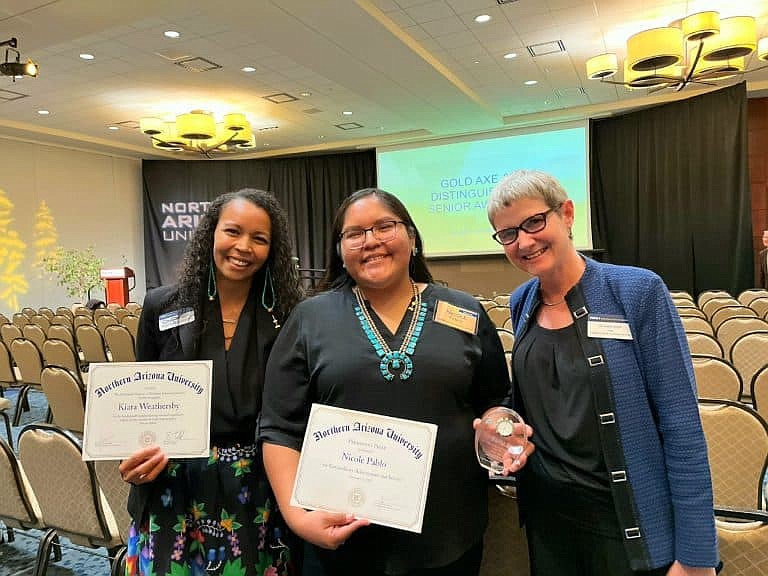 Kiara Weathersby, Nicole Pablo and another woman at the Gold Axe ceremony. (Photo/NAU)