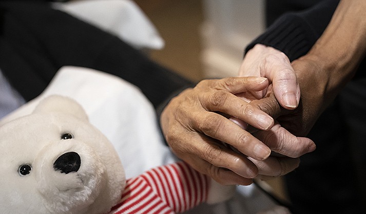 As nursing home leaders redouble efforts to get staff and residents boosted with the new vaccine version, now recommended for those 6 months and older, they face complacency, misinformation and COVID-19 fatigue. (AP Photo/Nathan Howard)