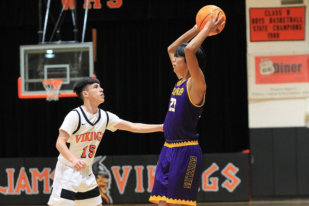 Shonto Prep's Bronson Deschine looks for an open man in the game with Williams Dec. 9. (Wendy Howell/NHO)