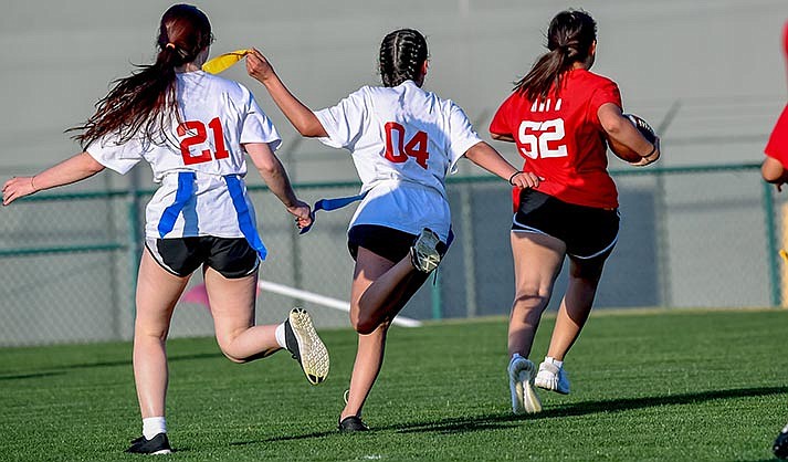 Girls' flag football has been sanctioned by the AIA for an inaugural season in the fall of 2023. (Adobe/stock)