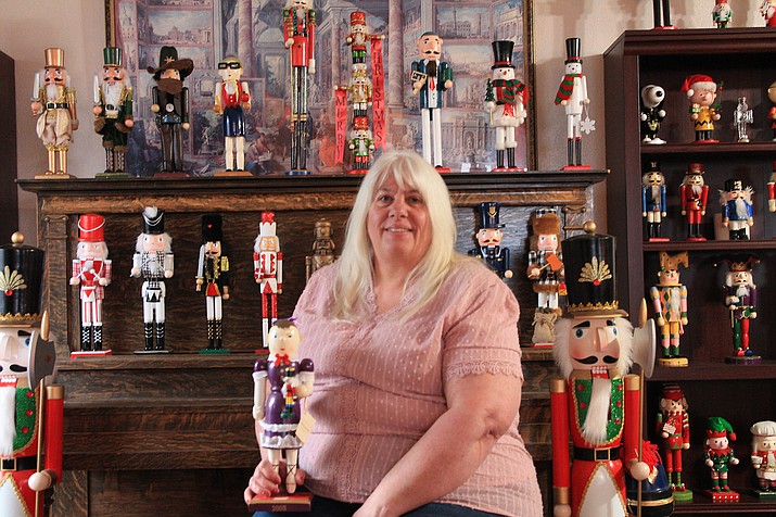 Karen Mack poses with some of her 219 piece nutcracker collection. (Summer Serino/WGCN)