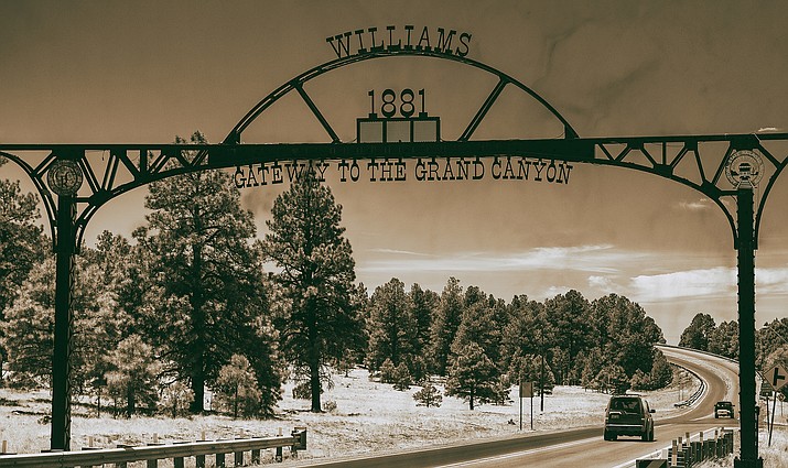 Large metal arches with the trademarked tagline welcome anyone who enters Williams. (Photo/Adobe stock)