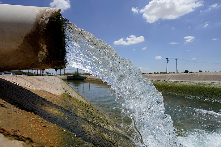Water from the Colorado River diverted through the Central Arizona Project fills an irrigation canal on Aug. 18, 2022, in Maricopa, Ariz. (AP Photo/Matt York, File)