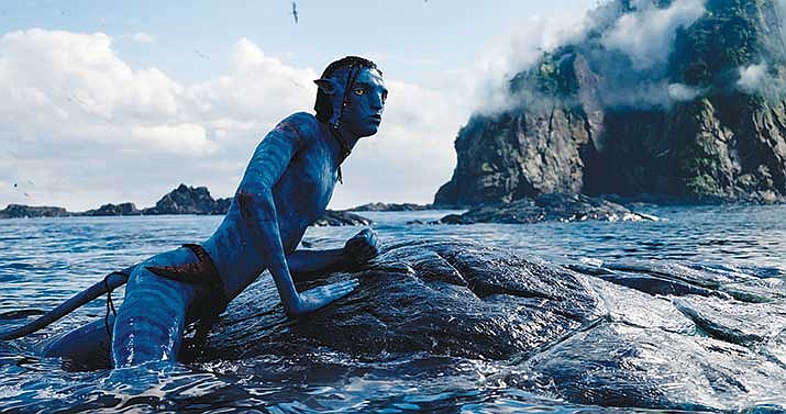 This image released by 20th Century Studios shows Britain Dalton, as “Lo'ak,” in a scene from "Avatar: The Way of Water." (20th Century Studios via AP)