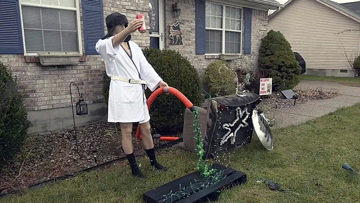 A 'Cousin Eddie' Christmas display is shown in the Dogwood subdivision of Shepherdsville, Ky. on Wednesday, Dec. 21, 2022. The display looked a little too real and police were called to check it out. Officers arrived to find a mannequin decorated like the character from “National Lampoon's Christmas Vacation." Homeowner Joni Keeney said she decided to put up the display from her favorite Christmas movie to have some fun.(WDRB via AP)