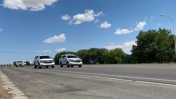 Navajo Nation Police Department escort an honor possession in Shiprock, New Mexico, July, 19, 2021. (Crystal Ashike/KSUT Tribal Radio)