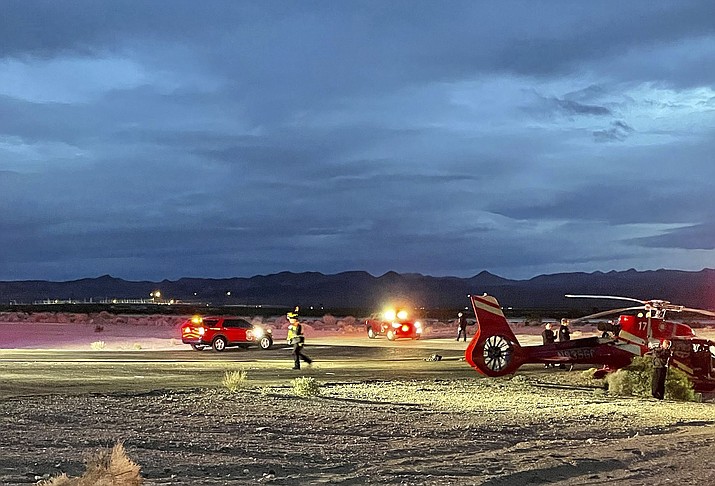 This image provided by Boulder City communications manager Lisa LaPlante shows a Grand Canyon tour helicopter after a Dec. 27, crash described as a "hard landing" at Boulder City Municipal Airport. Officials say the pilot and six passengers were taken to Las Vegas-area hospitals with injuries that were not life-threatening. (Lisa LaPlante/Boulder City via AP)
