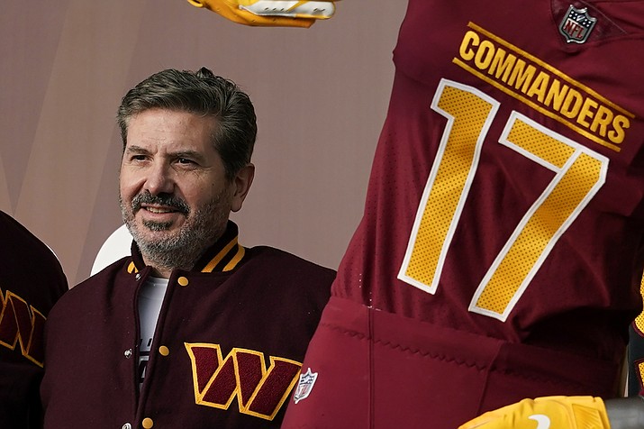 Washington Commanders owner Dan Snyder poses for photos during an event to unveil the team’s new identity on Feb. 2, 2022, in Landover, Md. Hardly a day passed in 2022 when a headline running across the ticker on ESPN would have been fitting on CNN or Fox Business. The intersection between sports and real life ranged from toxic workplace environments, alleged sexual misconduct, sportswashing, cryptocurrency, transgender sports and the COVID-19 pandemic. (Patrick Semansky/AP, File)