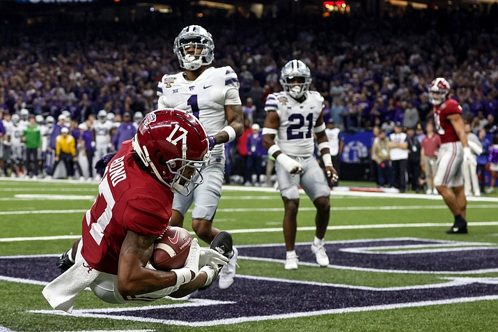 Alabama wide receiver Isaiah Bond (17) catches a pass for a touchdown as Kansas State safety Josh Hayes (1) defends during the first half of the Sugar Bowl NCAA college football game Saturday, Dec. 31, 2022, in New Orleans. (Butch Dill/AP)