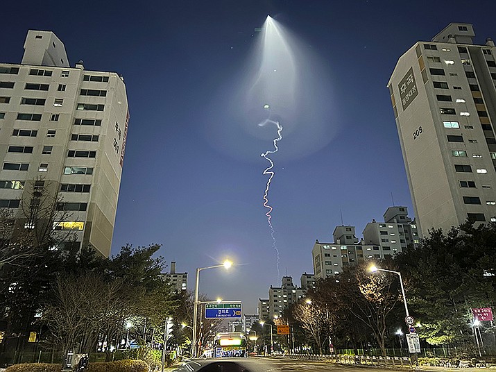 The light trail is seen in Goyang, South Korea, Friday, Dec. 30, 2022. South Korea's military confirmed it test-fired a solid-fueled rocket on Friday, after its unannounced launch triggered brief public scare of a suspected UFO appearance or a North Korean missile or drone flying. (Ahn Young-joon/AP)