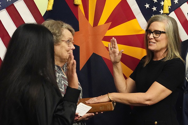 New Arizona Democratic Gov. Katie Hobbs takes the oath of office in a ceremony at the state Capitol in Phoenix, Jan. 2. (AP Photo/Ross D. Franklin, Pool)
