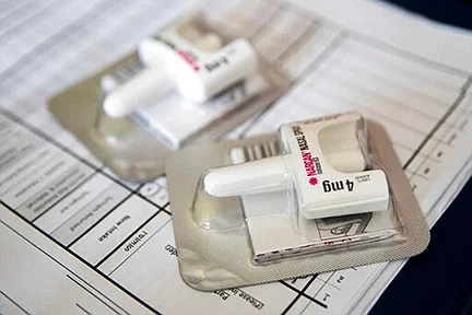 This July 3, 2018 file photo shows a Narcan nasal device which delivers naloxone in the Brooklyn borough of New York. On Tuesday, Aug. 6, 2019, health officials reported that prescriptions of the overdose-reversing drug naloxone are soaring, and experts say that could be a reason overdose deaths have stopped rising for the first time in nearly three decades. (AP Photo/Mary Altaffer)