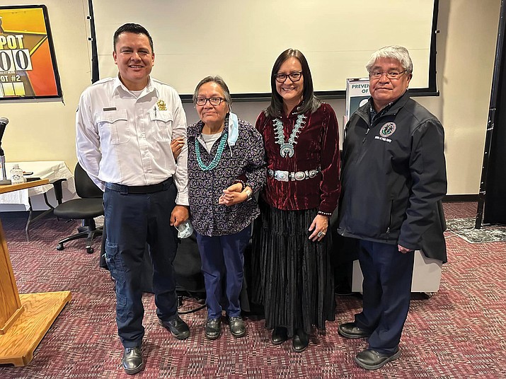 Darlene Mills (center left) was recognized by Public Safety Director Jesse Delmar (left) and Phefelia Nez (center right) for her 43 years of service to Navajo Nation EMS. (Photo/NNOP)