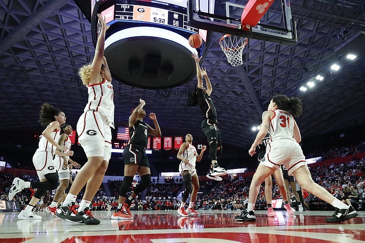 South Carolina guard Zia Cooke, second from right, shoots over Georgia guard Audrey Warren, right, during the second half of a game in Athens, Ga., Monday, Jan. 2, 2023. (Alex Slitz/AP)