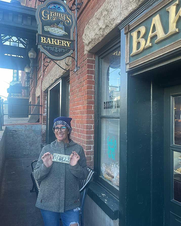 Grama’s Bakery II owner Jessica Haggerty displays her first dollar from 8 years ago. (Courtesy photo)