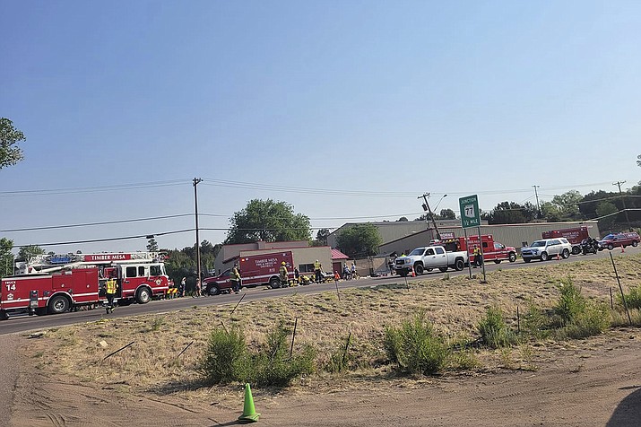 In this June 19, 2021, file photo, released by the Timber Mesa Fire and Medical District, emergency personnel gather at the scene of a mass casualty incident near Downtown 9 in Show Low, Ariz. . A cyclist has died after he was struck by an Arizona driver who plowed his pickup truck into a group of people participating in a bike race, authorities said. The driver, Shawn Michael Chock, 37, was quietly sentenced on Nov. 9, 2022, according to Navajo County Superior Court records. Under a plea agreement, Chock will serve 26-1/2 years in total(Timber Mesa Fire and Medical District via AP, File)