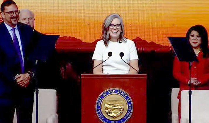 Flanked by other newly elected state officials, Gov. Katie Hobbs addresses a crowd at the capitol in Phoenix Thursday, Jan. 5, 2023. Democrat Secretary of State Adrian Fontes (left) and re-elected Republican Treasurer Kimberly Yee (right) were among those who also offered inaugural addresses. (Office of the Governor)