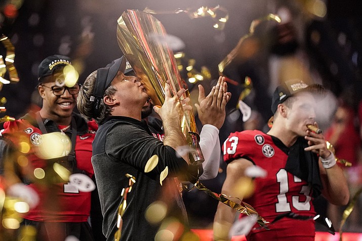 Georgia head coach Kirby Smart kisses the championship trophy after the national championship NCAA College Football Playoff game against TCU, Monday, Jan. 9, 2023, in Inglewood, Calif. Georgia won 65-7. (Ashley Landis/AP)