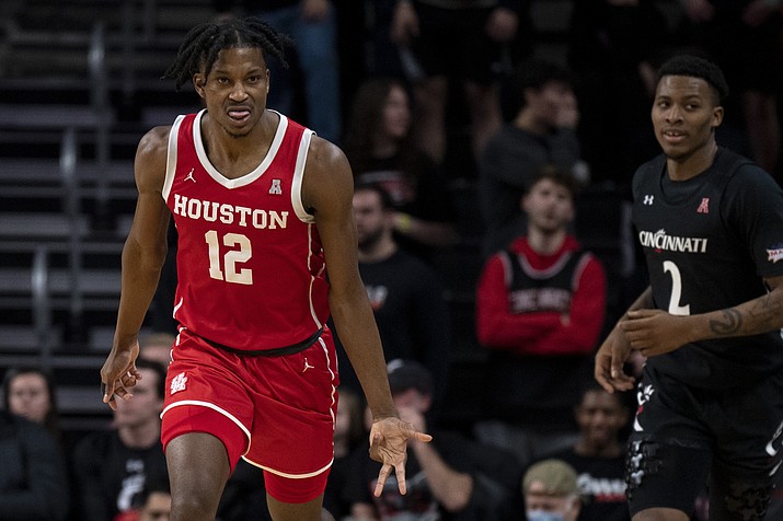Houston Cougars guard Tramon Mark (12) celebrates after hitting a 3-point shot in the second half of an NCAA college basketball game against Houston Cougars on Sunday, Jan 8, 2023, in Cincinnati. (Albert Cesare/The Cincinnati Enquirer via AP)