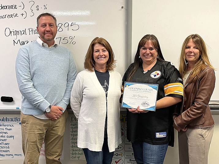 Keri Guggisberg (center right) is recognized by Eric Evans, Tammara Ragsdale and Cheryl Mango-Paget as one of three Williams candidates for Coconino County Teacher of the Year. (Photo/Coconino County Education Service Agency)
