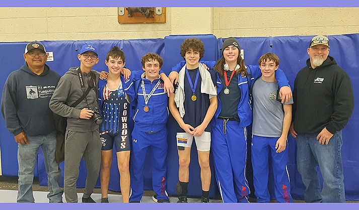 From left, coach Calvin Bahe, manager Austin Dexter, sophomore Ari Hammond 144 pounds., junior Joey Dickey  157 pounds, senior Jeremy Jones 150 pounds, senior Tristan Black 215 pounds, sophomore Jake Dickey 132 pounds, and head coach Travis Black. Not pictured: sophomore Jacob Jones 138 pounds, and junior Austin Pomeroy 165 pounds. (Photo courtesy of Peggy Kellogg)