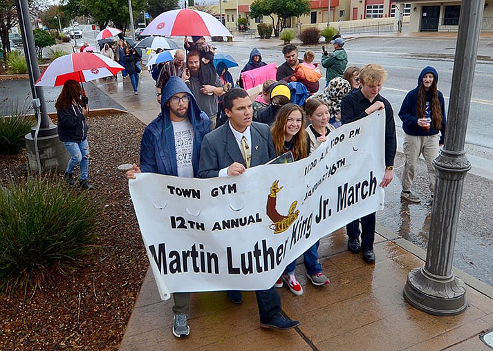 Camp Verde resident Chandler Plante (front in gray suit coat and tie) has led Martin Luther King Jr. Day marches down Camp Verde’s Main Street 12 consecutive years, including on Monday, Jan. 16, 2023. (VVN/Vyto Starinskas)