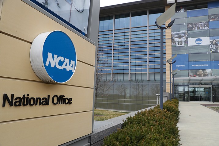 This is a March 12, 2020, photo showing NCAA headquarters in Indianapolis. The NCAA and many of its student-athletes are closely watching a court case in Pennsylvania that could determine whether Division I athletes should be paid for their time in the same way students are paid for work-study jobs. (Michael Conroy/AP, File)