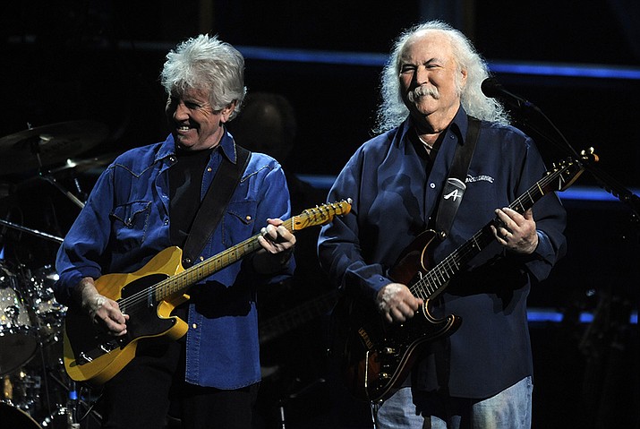 David Crosby, right, and Graham Nash perform at the 25th Anniversary Rock & Roll Hall of Fame concert at Madison Square Garden, Thursday, Oct. 29, 2009, in New York. Crosby, the brash rock musician who evolved from a baby-faced harmony singer with the Byrds to a mustachioed hippie superstar and an ongoing troubadour in Crosby, Stills, Nash & (sometimes) Young, has died at age 81. His death was reported Thursday, Jan. 19, 2023, by multiple outlets. (Henny Ray Abrams, AP File)
