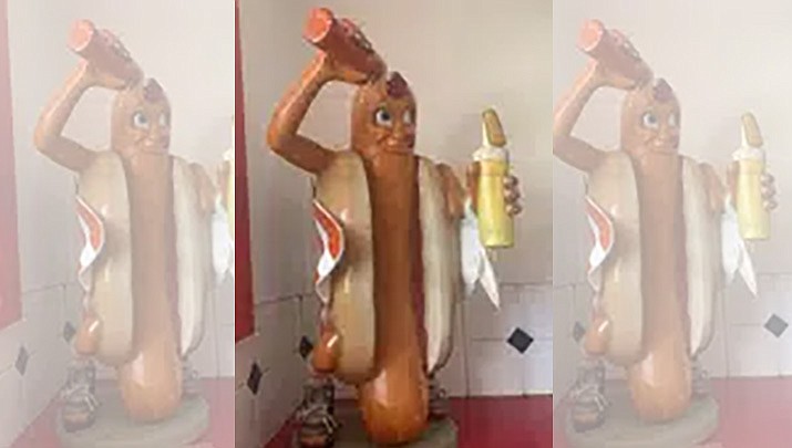 A statue of a hot dog is shown at the Dairy Winkle restaurant, April 14, 2022, in the Campbells Creek section of Charleston, W.Va. The Kanawha County Sheriff's Office says the statue, which was stolen from the business during a break-in sometime after a Jan. 11, 2023, fire, has been returned. (Lori Kersey/Charleston Gazette-Mail via AP)