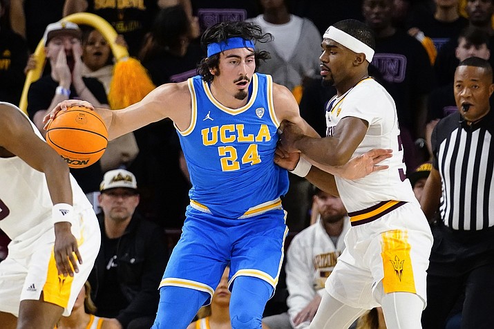 UCLA's Jamie Jaquez Jr. (24) is defended by Arizona State's Devan Cambridge (35) during the second half of a game Thursday, Jan. 19, 2023, in Tempe, Ariz. UCLA won 74-62. (Darryl Webb/AP)